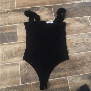 It is a black Double Zero bodysuit.